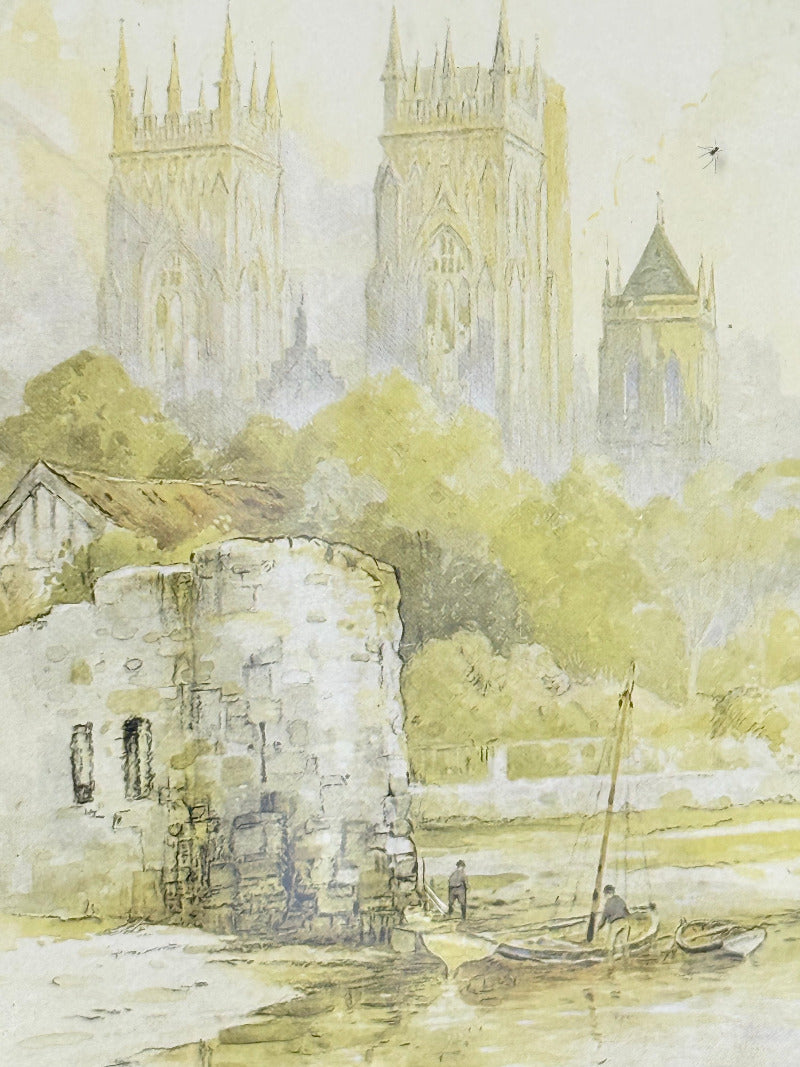 framed print of york minster and city walls in black frame, photographed on white surface