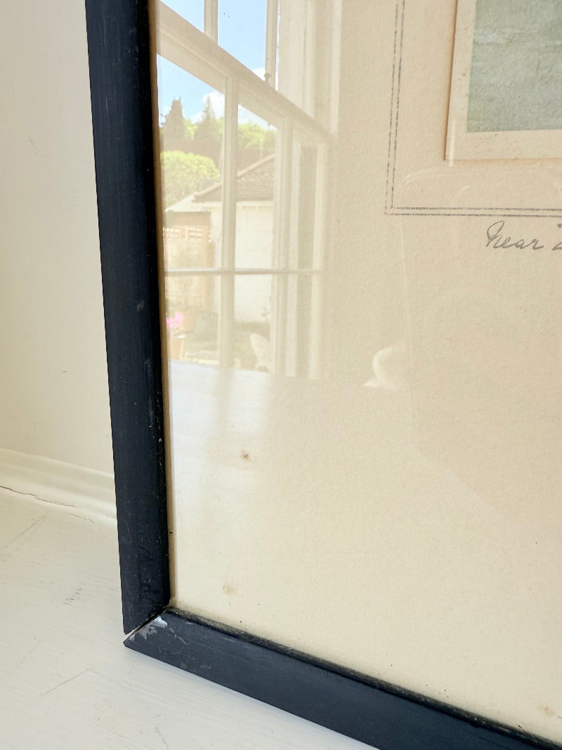 framed print of dutch windmill beside water in holland with reflection photographed on white surface