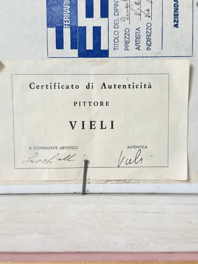 An antique Italian authenticity certificate for the painter Viali, dated 1912, displayed on a light-colored wooden surface with other vintage papers visible above.