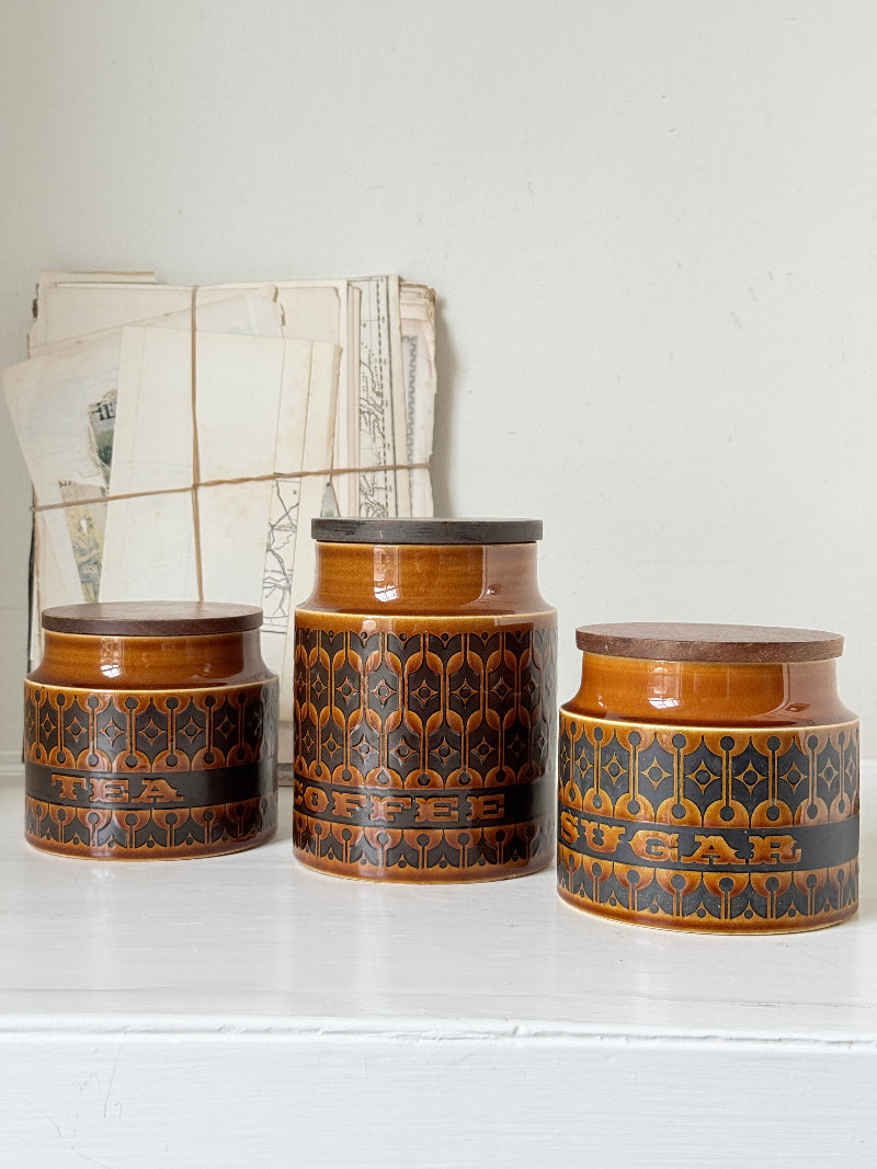Hornsea Heirloom coffee tea and sugar canister set in autumn brown stoneware with teak lids photographed on a white surface