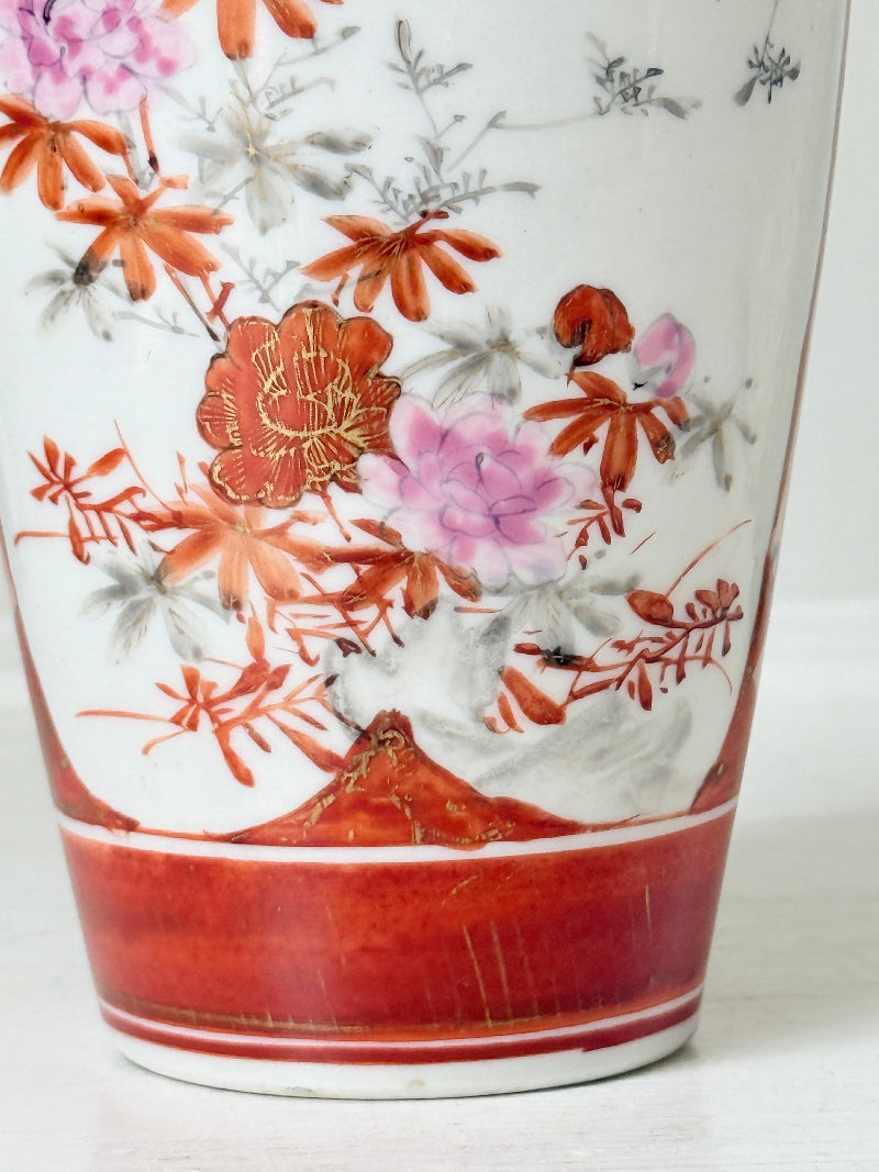 Japanese Kutani porcelain vase hand painted with flowers in white panels on an iron red and gold ground