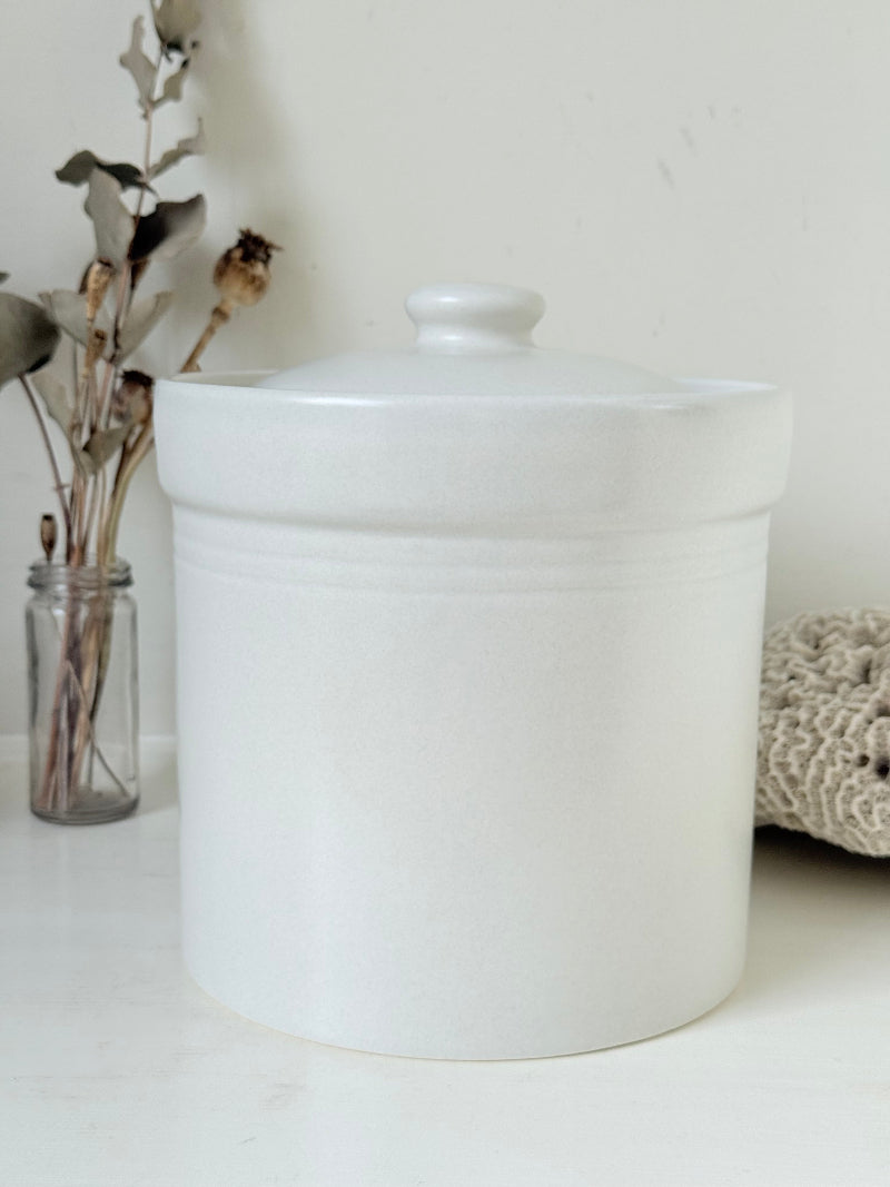 Pfaltzgraff Yorktowne stoneware flour pot with blue floral motif and lid, photographed on a white surface