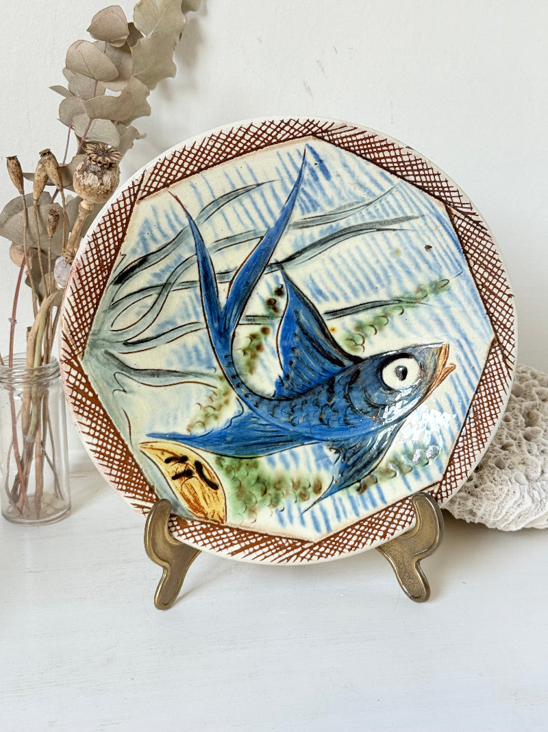 Vintage Puidgemont hand painted fishbowl with blue fish motif, photographed on a white surface