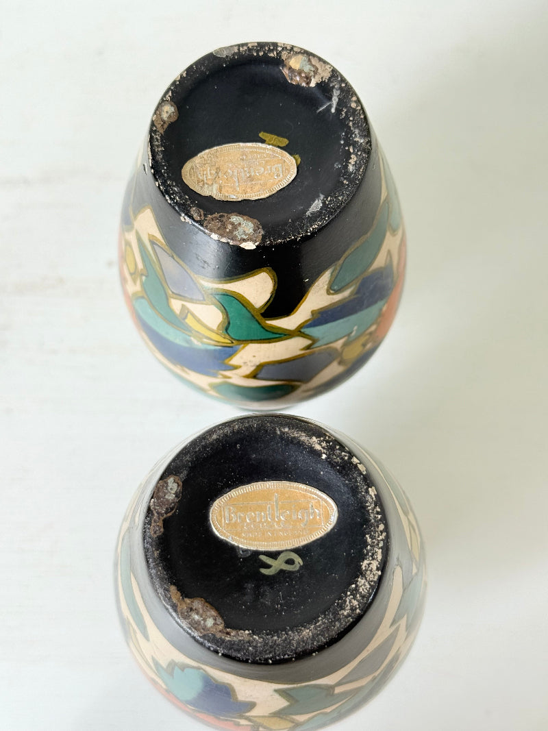 Pair of hand painted Brentleigh Ware Art Deco stoneware vases with bold floral design, photographed on a white surface