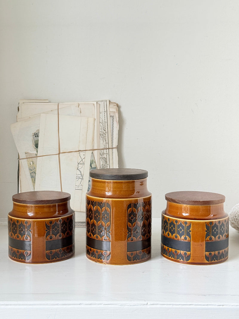 Hornsea Heirloom coffee tea and sugar canister set in autumn brown stoneware with teak lids photographed on a white surface