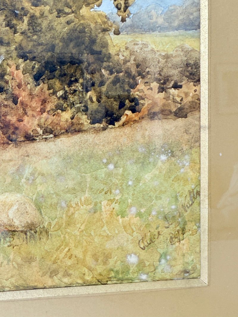 Antique watercolour landscape in gilt frame, countryside scene with trees, photographed on white surface.