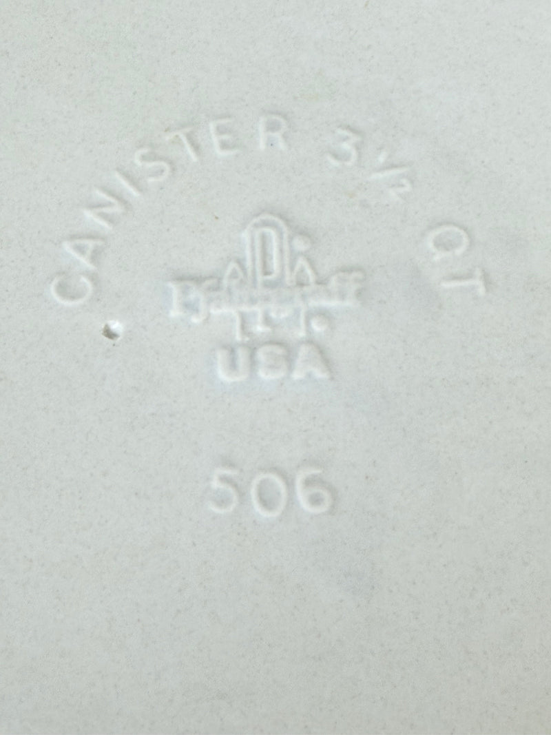 Pfaltzgraff Yorktowne stoneware flour pot with blue floral motif and lid, photographed on a white surface