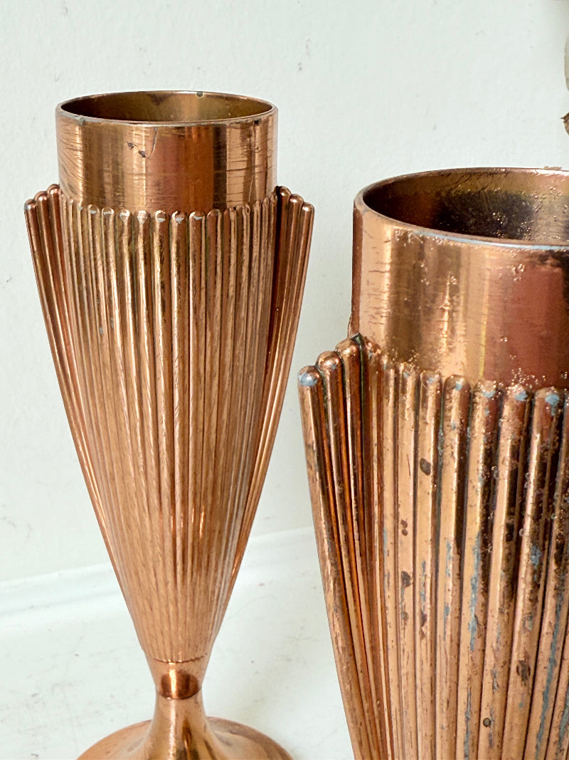 Pair of vintage copper Art Deco vases with fluted surface, photographed on a white background.