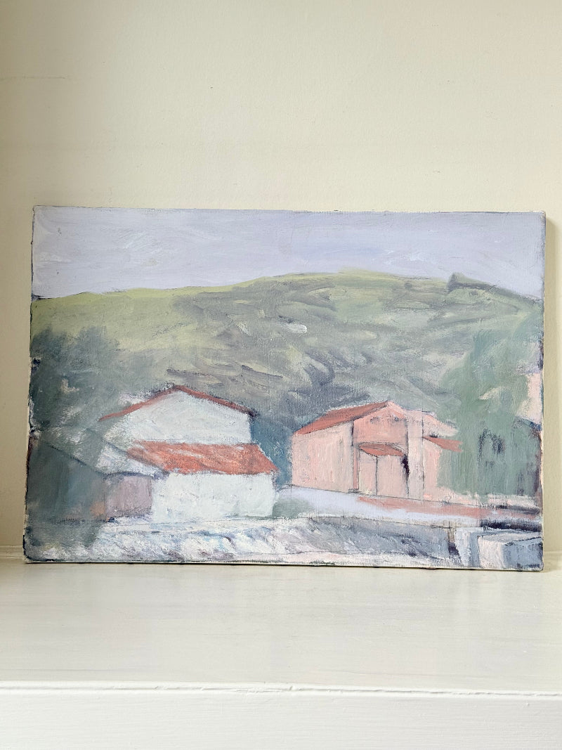Unframed vintage oil painting of hillside cottages with terracotta roofs, green landscape, and textured brushwork, on white surface.