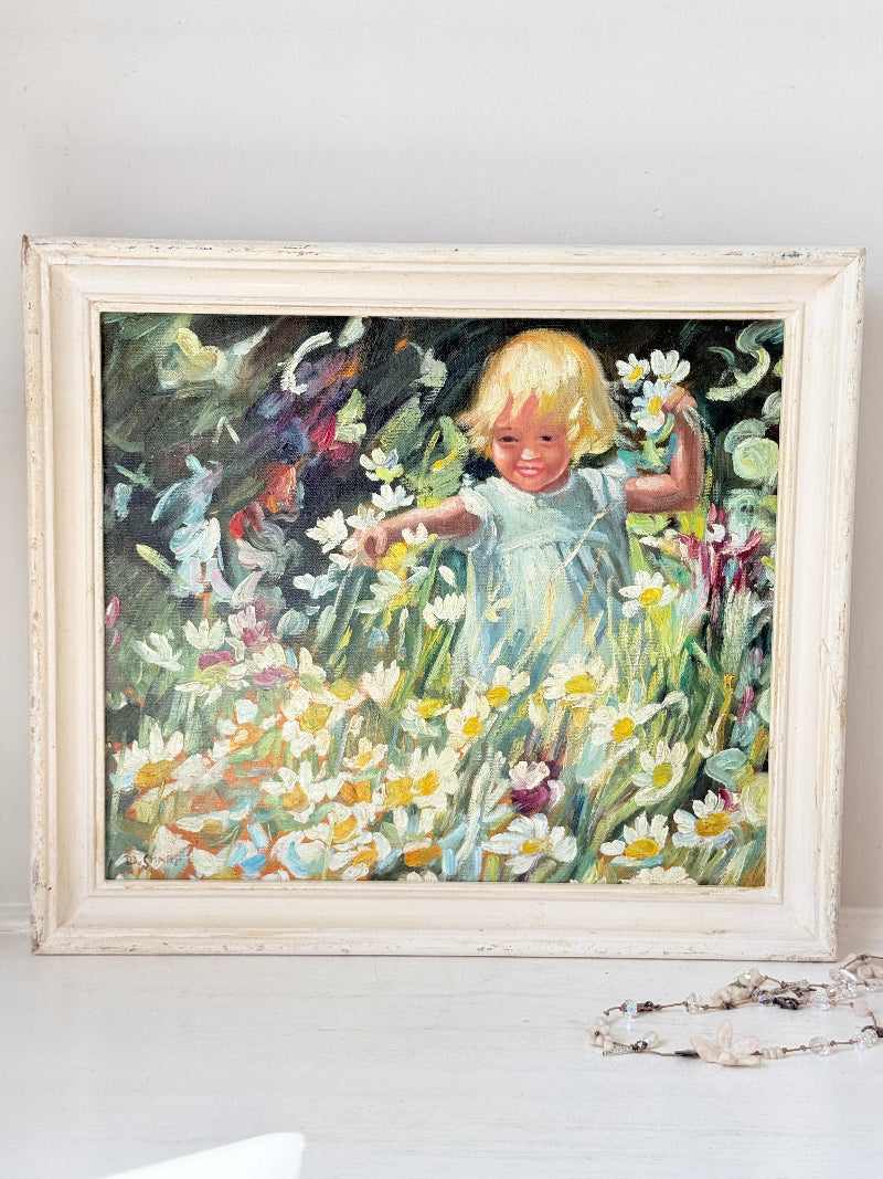 Oil painting after Dorothea Sharp of a young girl picking white flowers in a meadow, distressed white wood frame