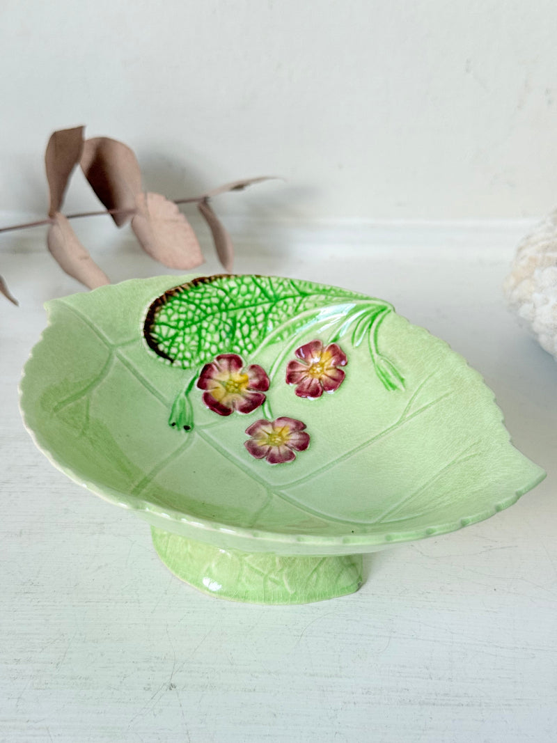 Vintage Carlton Ware green leaf pedestal dish with pansy decoration, photographed on a white surface