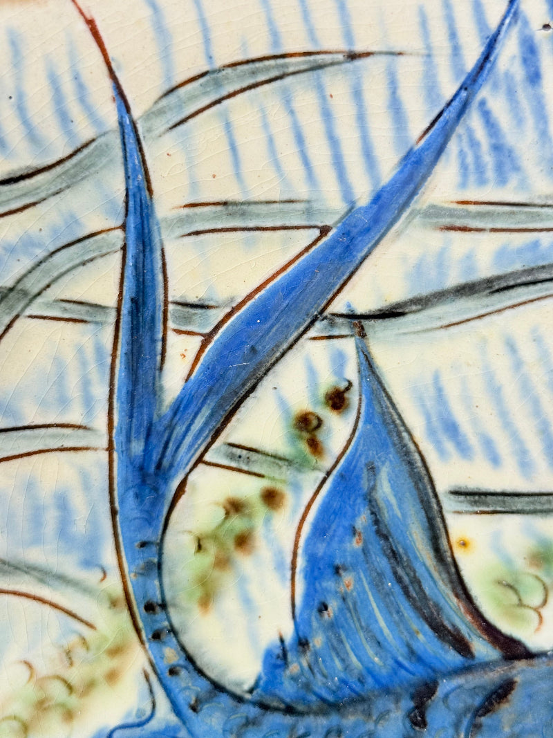 Vintage Puidgemont hand painted fishbowl with blue fish motif, photographed on a white surface