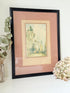 vintage framed print of temple bar watercolour by f robson in black frame with apricot and dusky pink mount on white surface