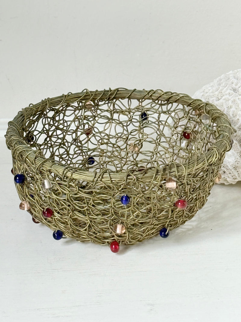 Vintage brass wire basket with coloured glass beads, photographed from multiple angles on a white surface
