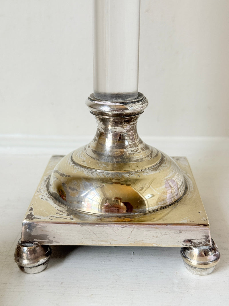Pair of Hollywood Regency silver plate and Perspex Lucite candlesticks on bun feet with green taper candles
