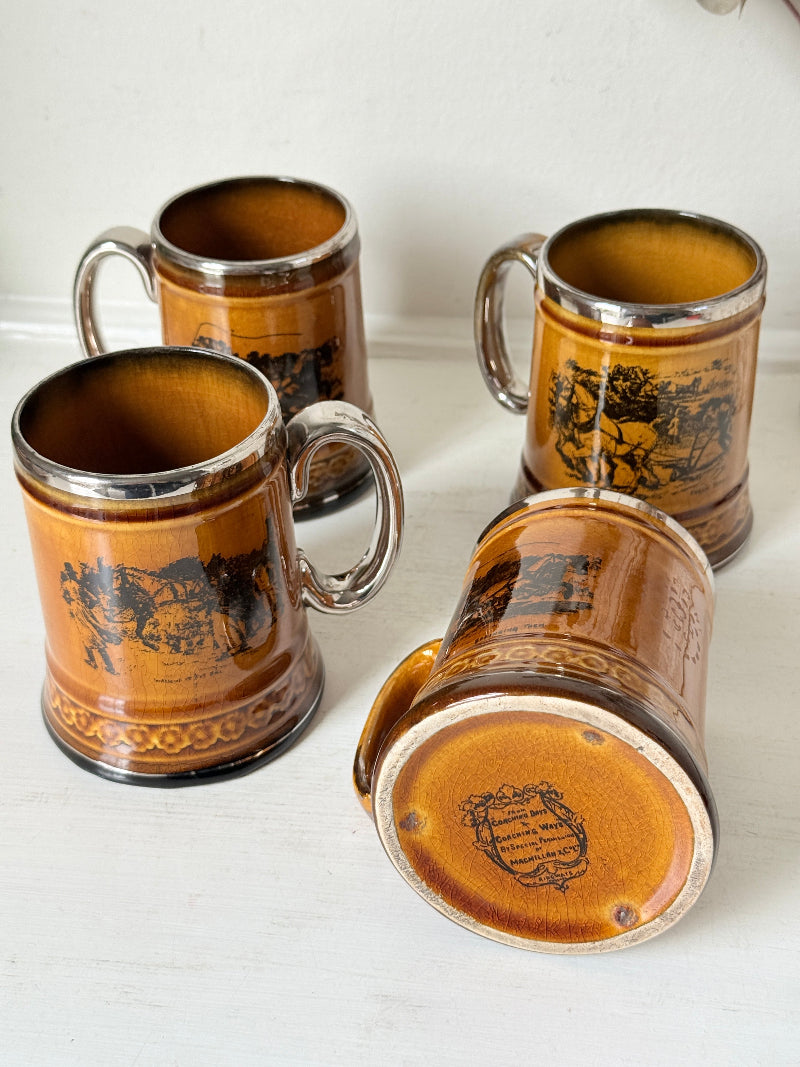 Set of 4 Ridgways stoneware tankard mugs photographed on a white surface in amber brown treacle glaze with black Coaching Days and Coaching Ways transfer scenes