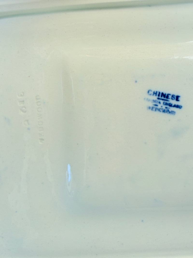 Vintage Wedgwood blue and white rectangular transferware plate with scenic design photographed on a white surface