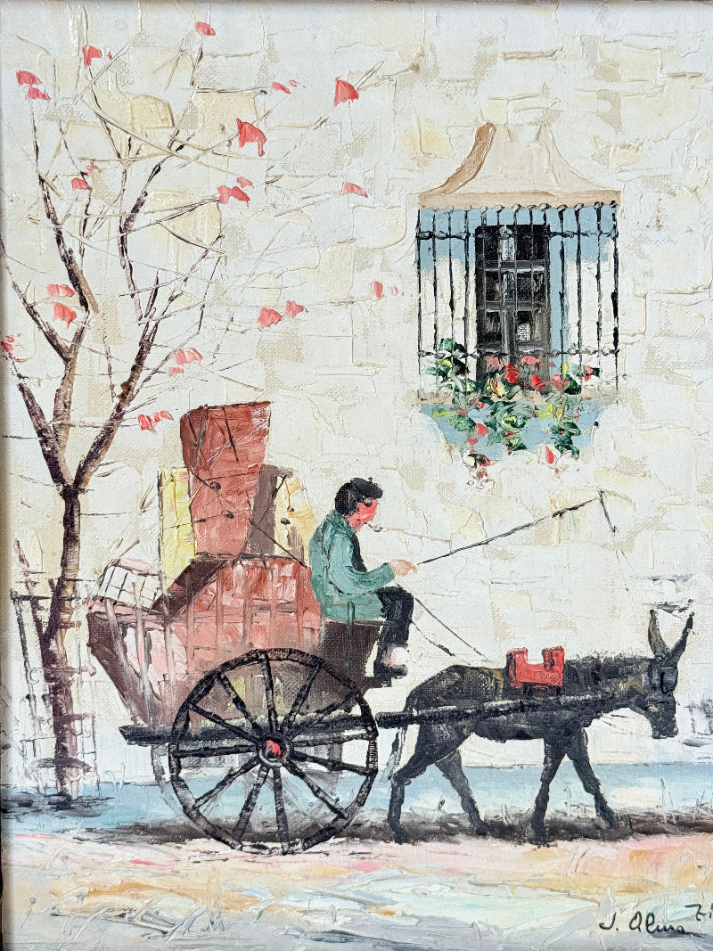 Vintage framed oil painting of horse and cart scene signed L. Cabanes photographed on a white surface