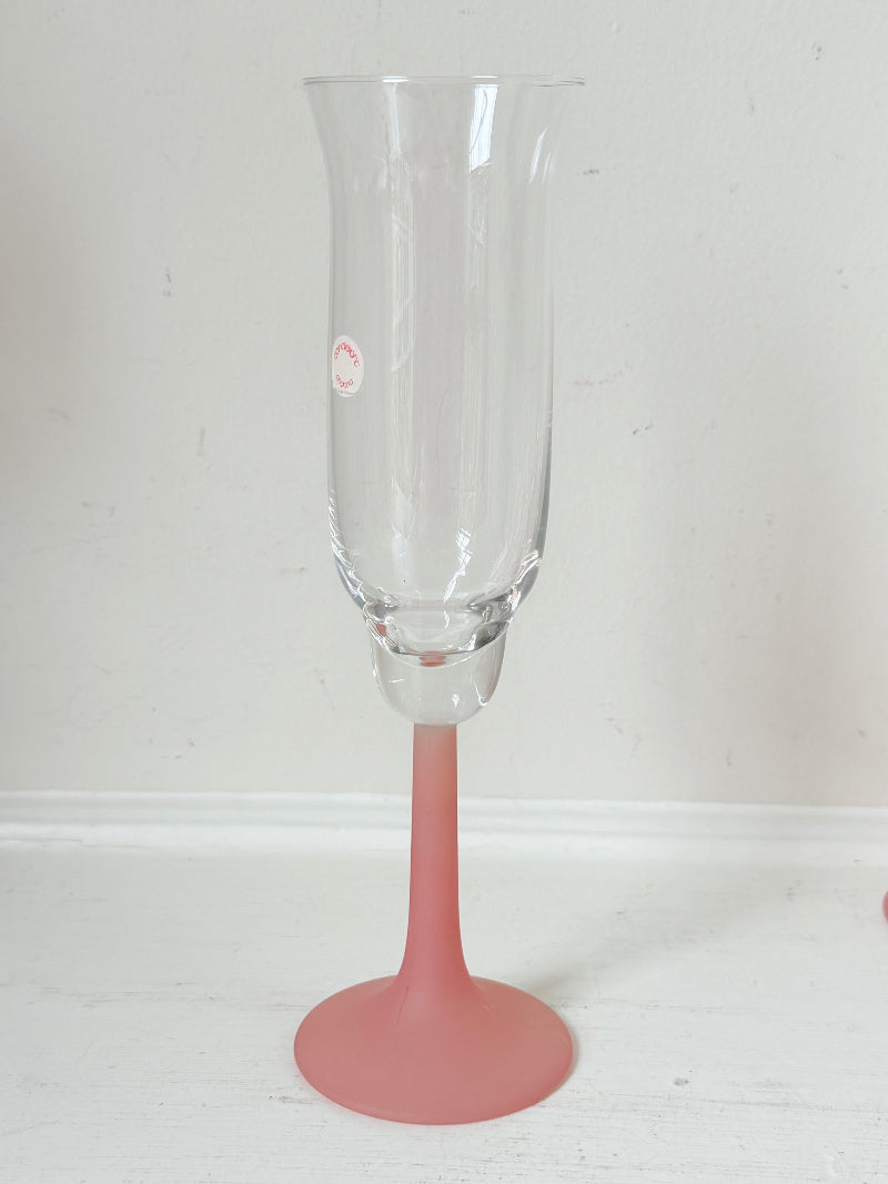 Set of five 1980s frosted pink tulip champagne flutes from the Candlelight range, photographed on a white surface