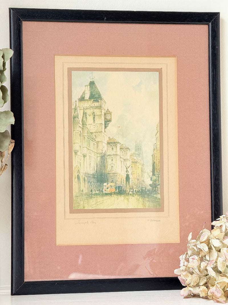 vintage framed print of temple bar watercolour by f robson in black frame with apricot and dusky pink mount on white surface