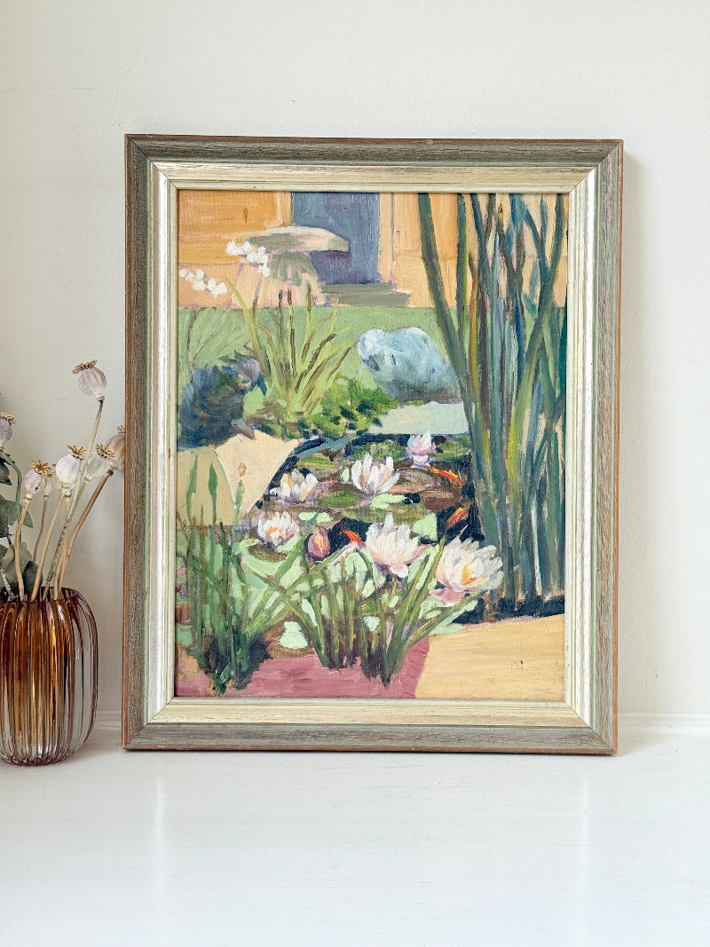 Vintage oil on board painting of waterlilies on a pond by Muriel Hester Broughton (1904–2003), monogrammed MB, framed in silver wood, photographed on a white surface