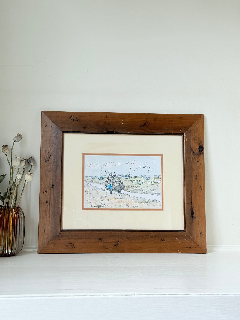 Vintage pen and watercolour coastal scene with horse and cart in rustic wood frame, signed, on white surface.