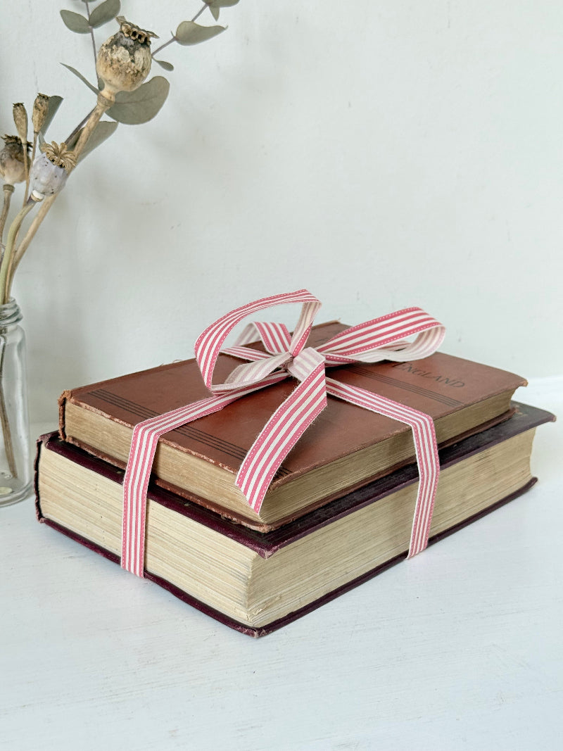Vintage book bundle of English Costume and History of England with burgundy and brown hardback covers, photographed on a white surface