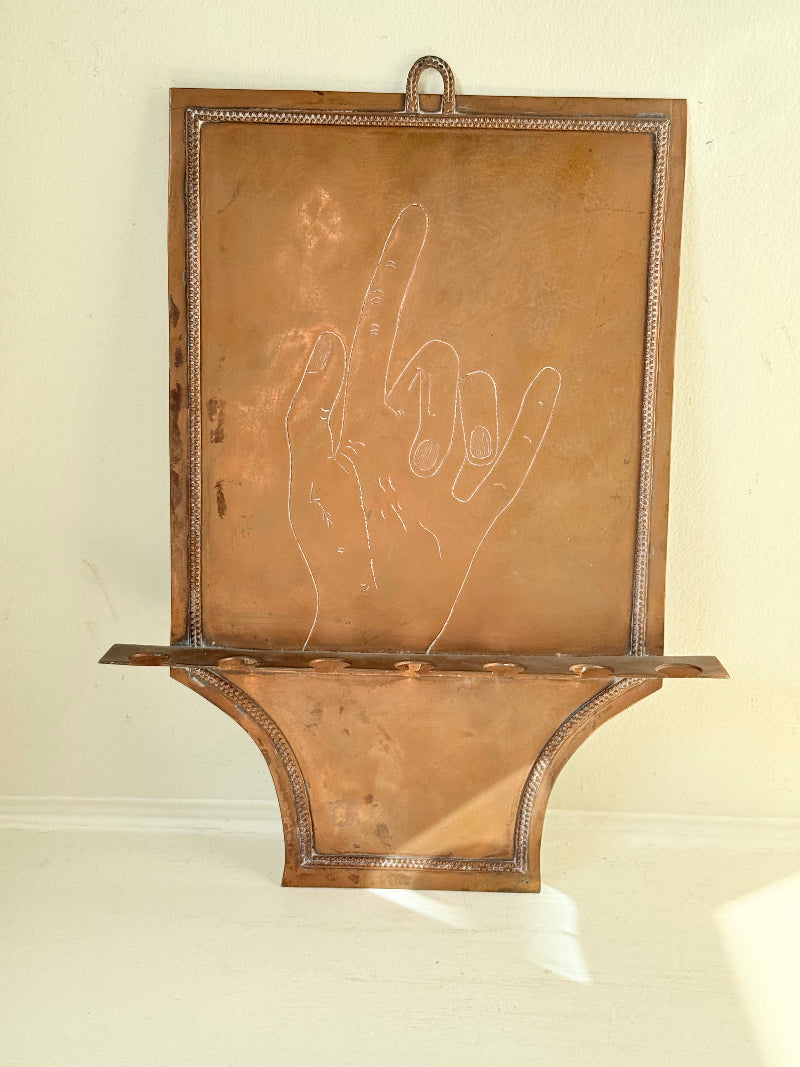 Vintage hanging copper pipe stand with hand etched design, ideal for holding utensils, tools or dog leads, photographed on a white surface beside dried stems.