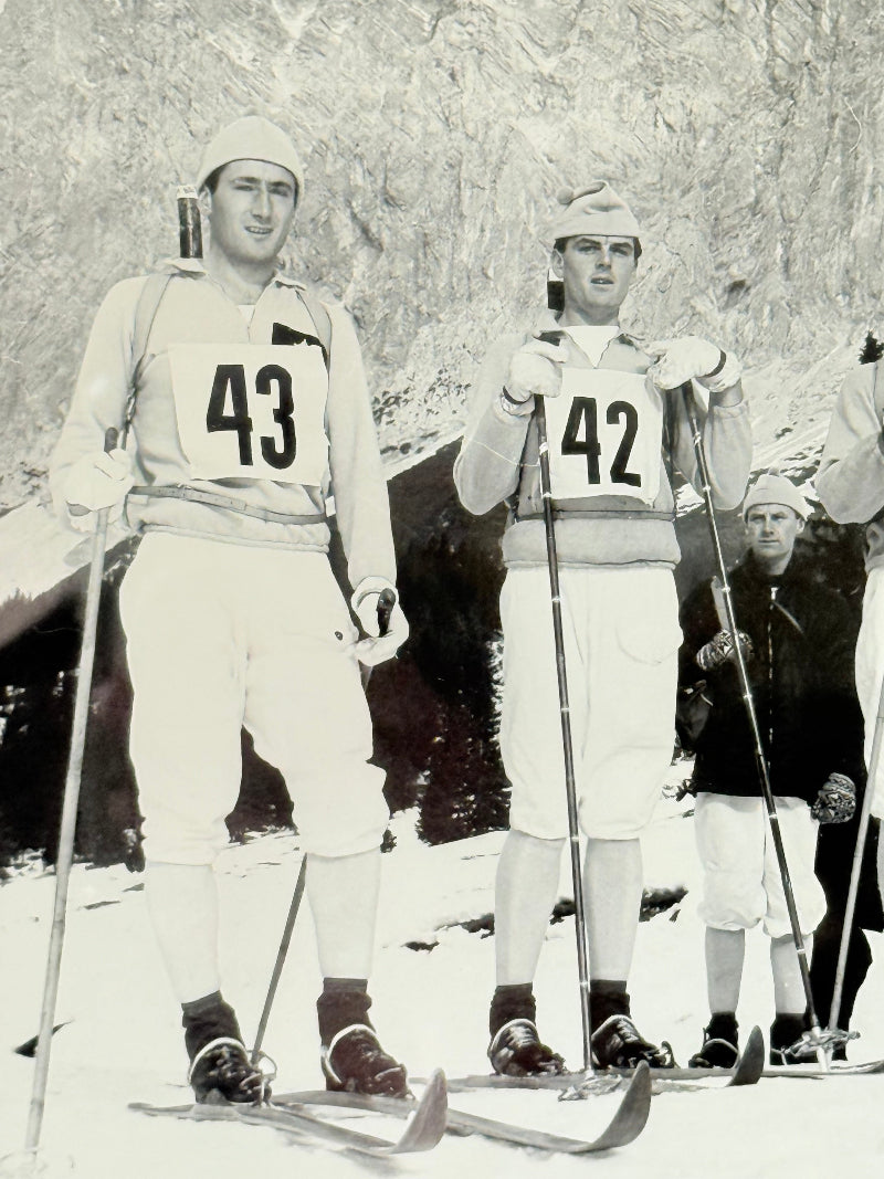 Vintage black and white framed photograph of the 1st Battalion Irish Guards Ski Team, 1963–64, posed in full ski gear against the Austrian Alps.