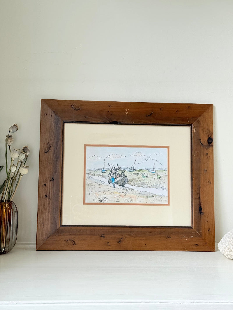 Vintage pen and watercolour coastal scene with horse and cart in rustic wood frame, signed, on white surface.