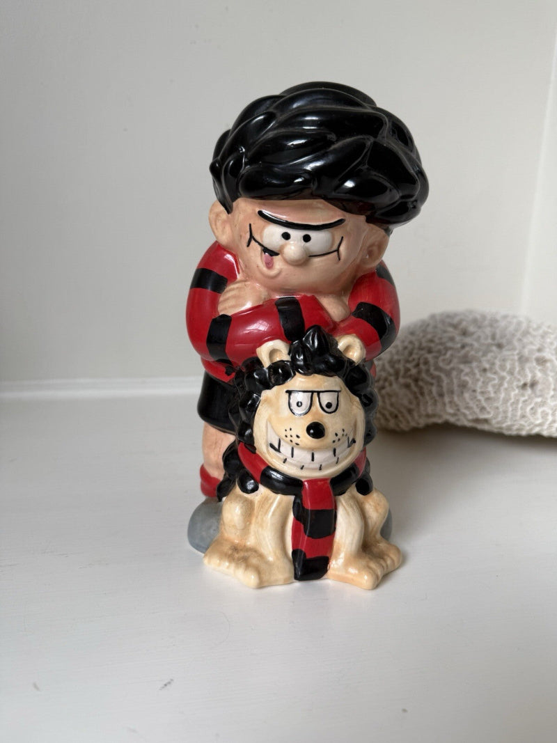 Dennis the Menace and Gnasher ceramic moneybox in red and black comic-style outfits, with vintage hand-painted detail.
