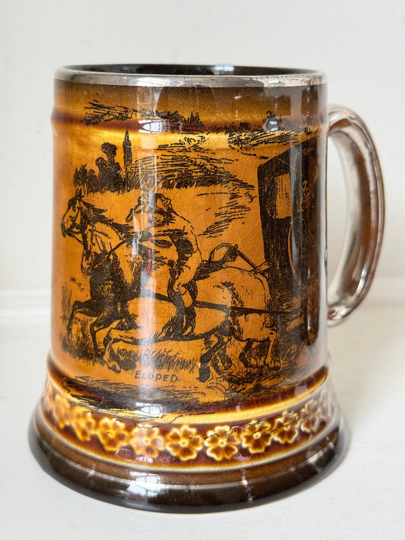 Set of 4 antique Ridgway stoneware beer tankards photographed on a white surface in amber treacle glaze with black Coaching Days and Coaching Ways scenes