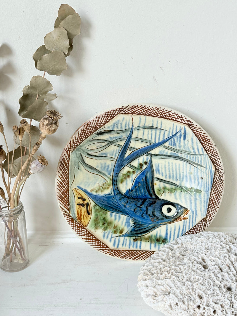 Vintage Puidgemont hand painted fishbowl with blue fish motif, photographed on a white surface