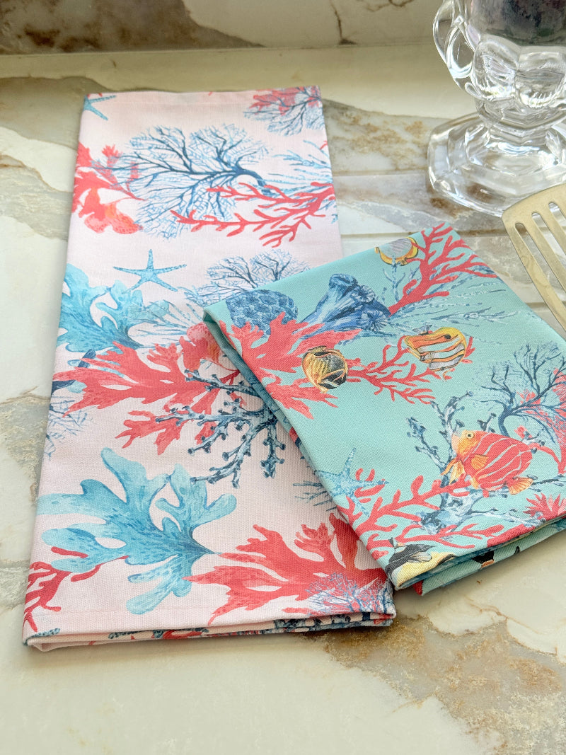 The Blue Loft Caribbean reef print cotton tea towel in turquoise with coral and tropical fish design