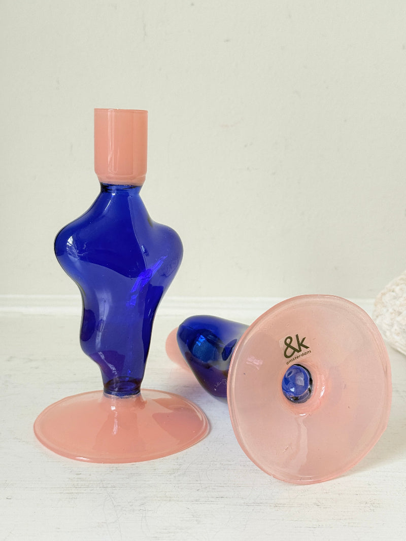 Pair of &Klevering Amsterdam Flux glass candle holders in dark blue and pink with pink taper candles