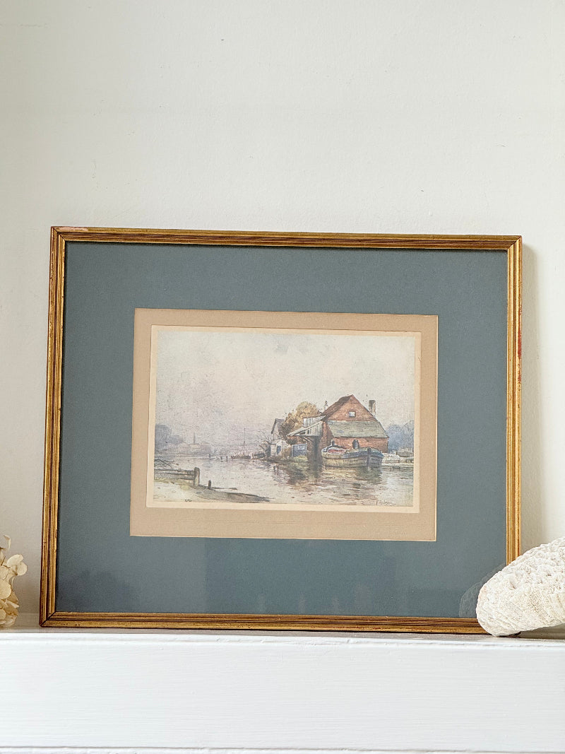 Vintage framed print of riverside mill by F Robson, gilt frame with blue mount, rustic water scene, photographed on white surface.