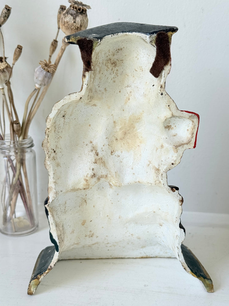 vintage hand painted cast iron owl doorstop with mortarboard and bow tie on white surface