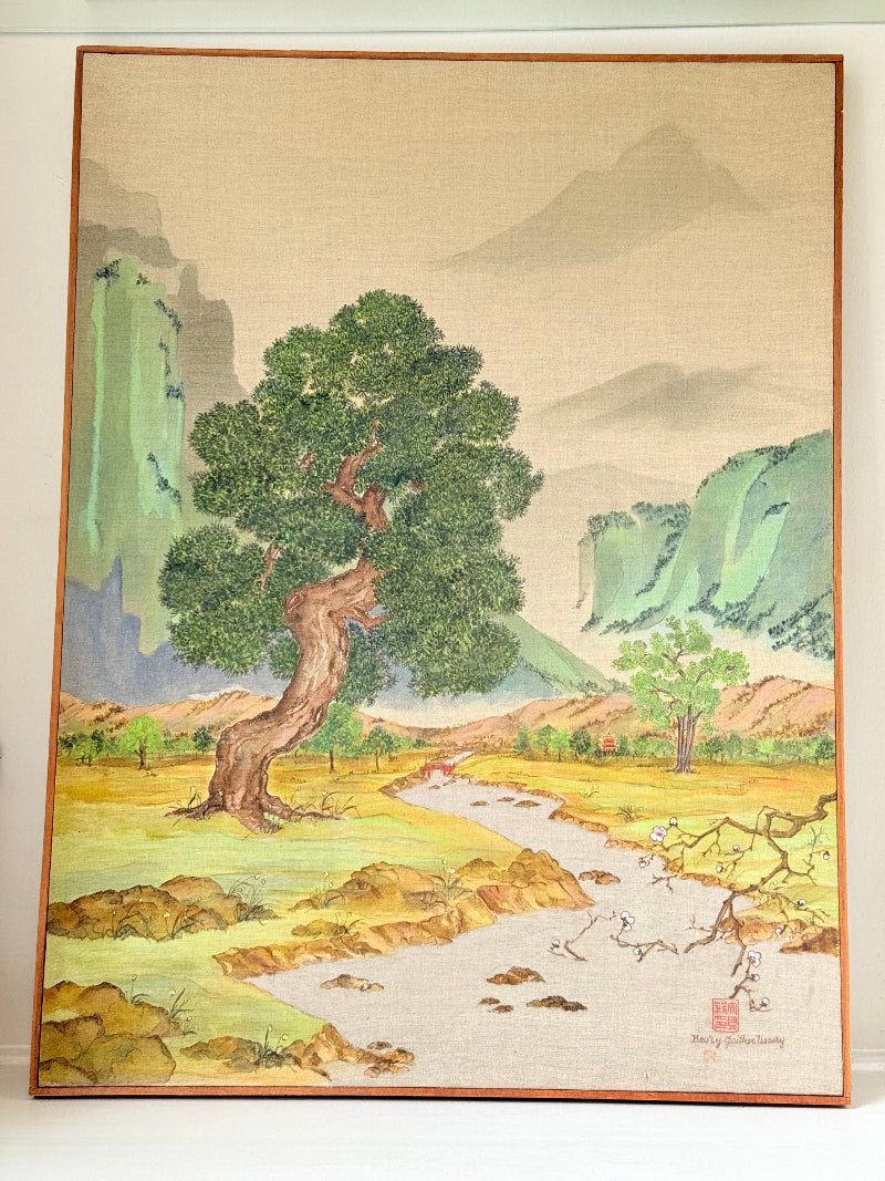 Vintage Chinese watercolour landscape on canvas with tree, mountains and blossom, photographed on white surface