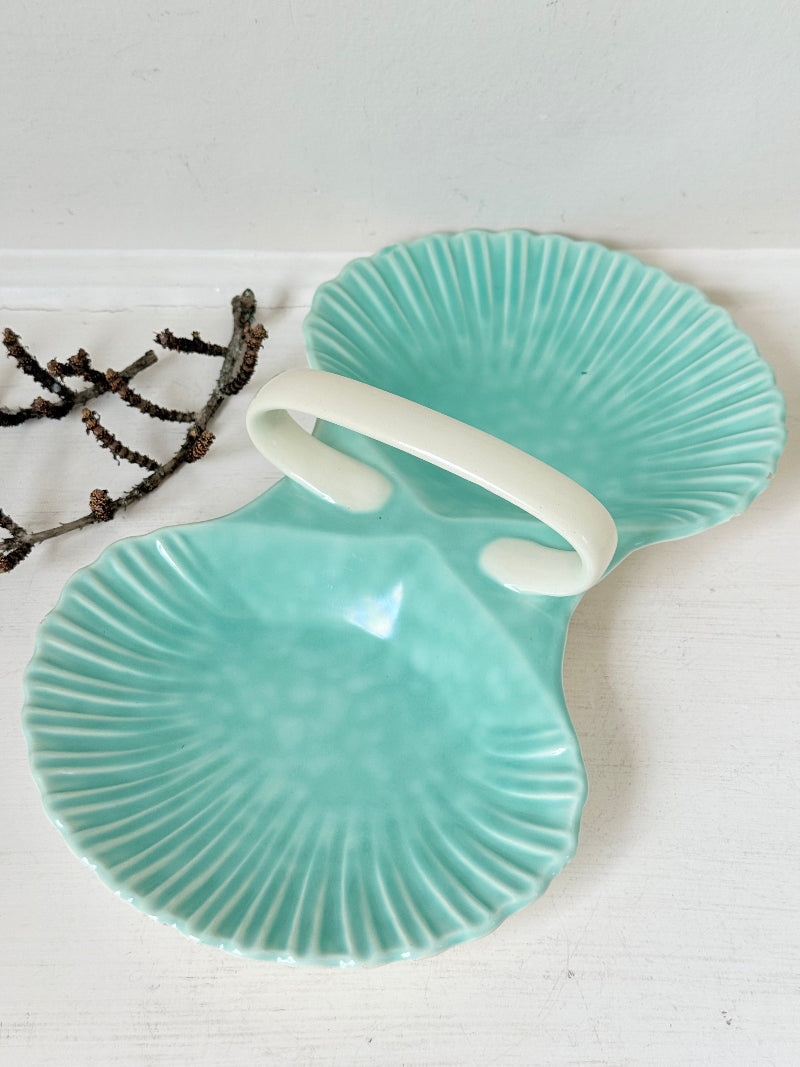Poole Pottery Shagreen double scallop dish in sea green glaze photographed on a white surface