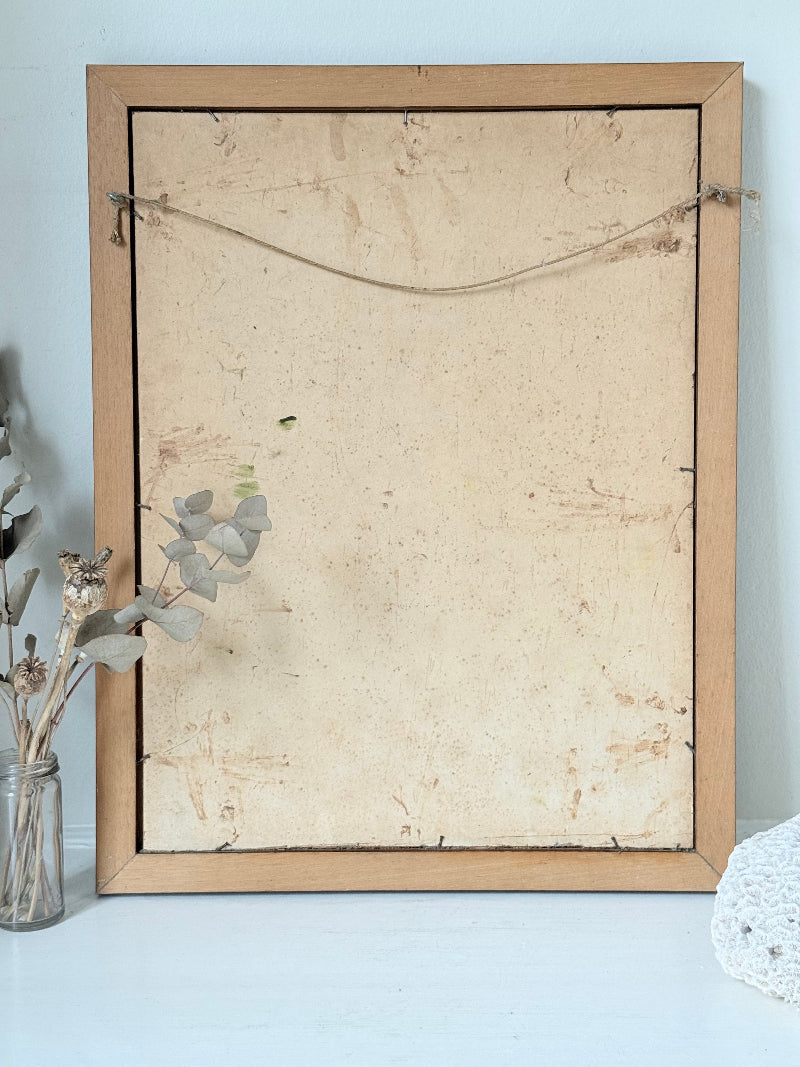 Oil painting of a dog by Muriel Hester Broughton in wooden frame, photographed on white surface.