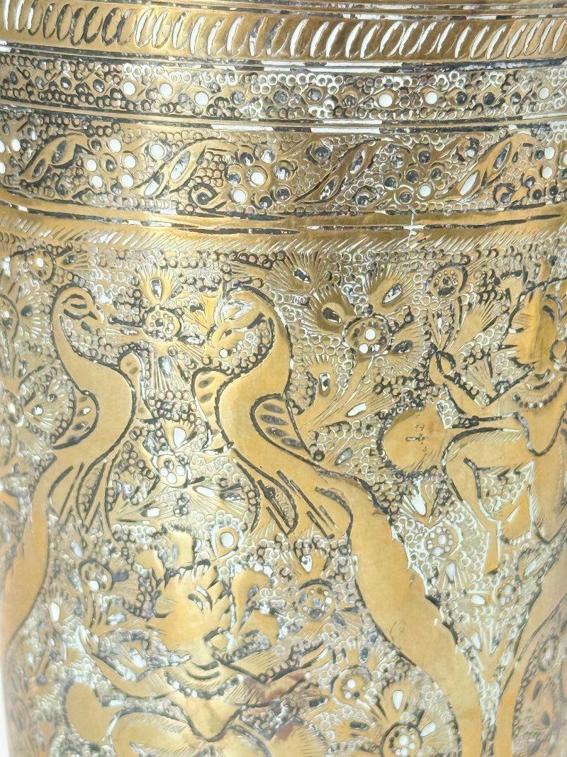 Indian Benares brass jar with lid and engraved animals and floral design, photographed on a white surface