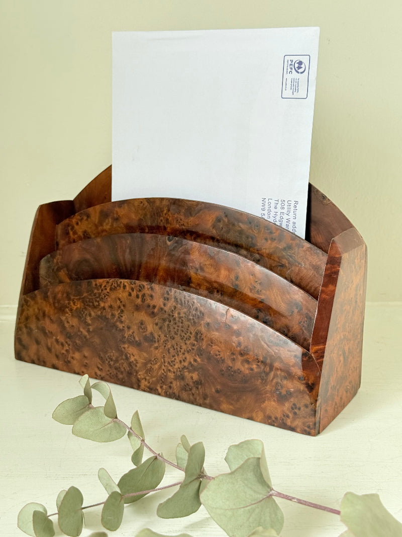 Three-slot curved letter rack made from polished burl wood with rich swirling grain, mid-century style desk organiser.