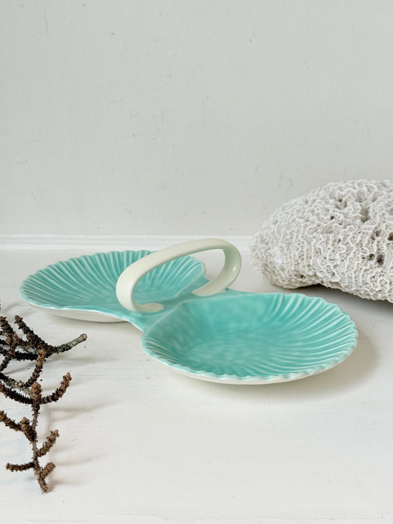 Poole Pottery Shagreen double scallop dish in sea green glaze photographed on a white surface