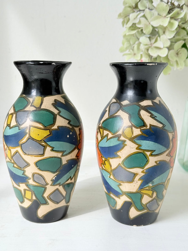 Pair of hand painted Brentleigh Ware Art Deco stoneware vases with bold floral design, photographed on a white surface