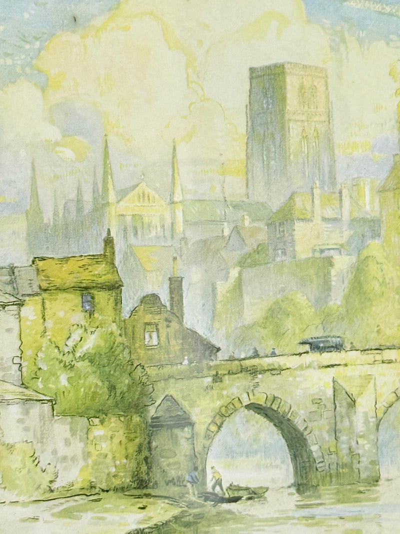 framed print of durham cathedral and elvet bridge with soft green and yellow tones photographed on white surface