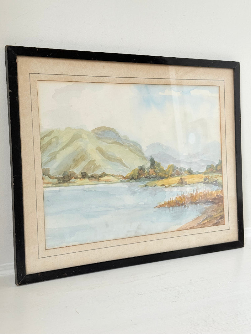 Vintage signed watercolour landscape of mountains and lake in black frame