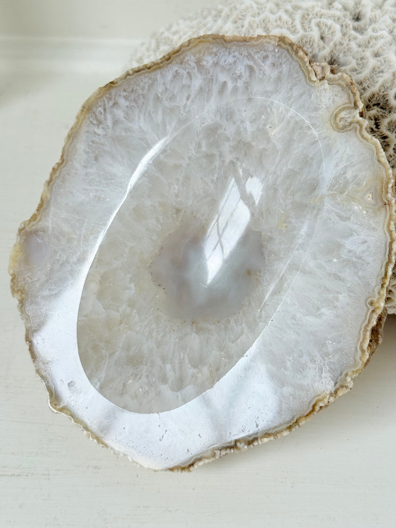 Vintage natural agate stone soap dish in grey and white, photographed on a white surface.