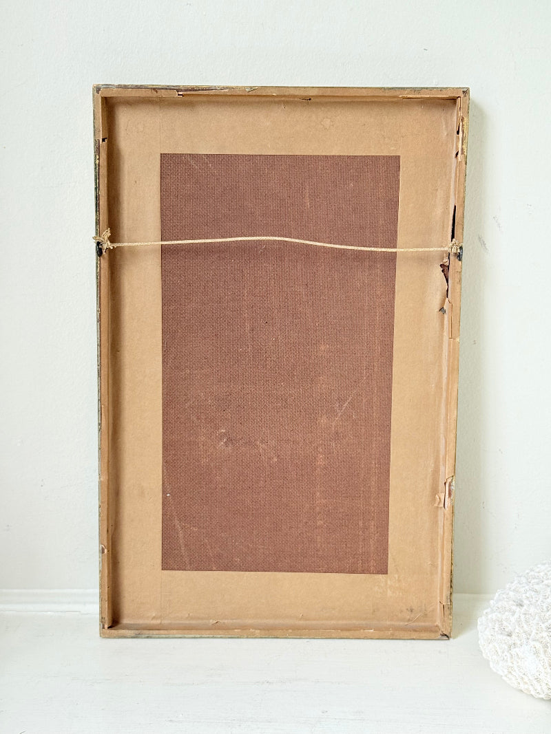 Vintage framed print of judge in ceremonial robes with humorous grumpy expression, photographed on a white surface