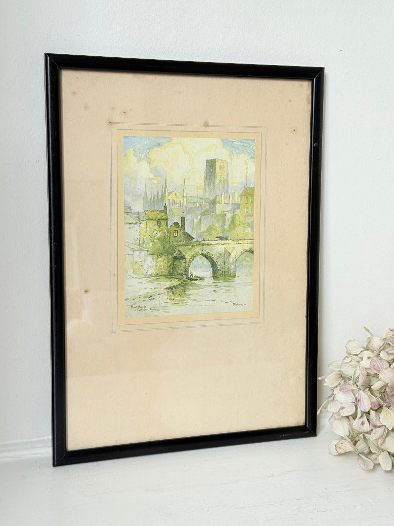 framed print of durham cathedral and elvet bridge with soft green and yellow tones photographed on white surface