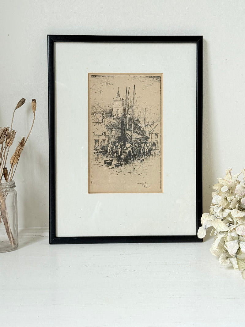 Vintage fishing harbour print in black frame, nautical scene wall art, styled on white surface with coastal decor accents